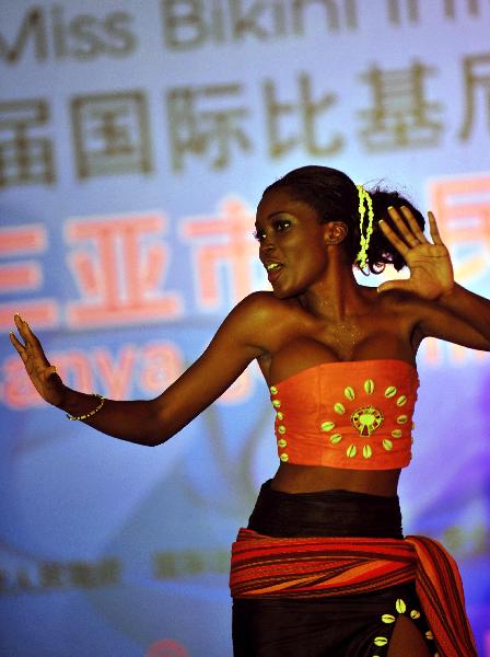 Owenga Volen Auma from Kenya dances on the stage in Sanya, south China's Hainan Province, May 20, 2010. The 35th Miss Bikini International World Final kicked off Thursday, a total of 64 contestans will take part in the ten-day competition.