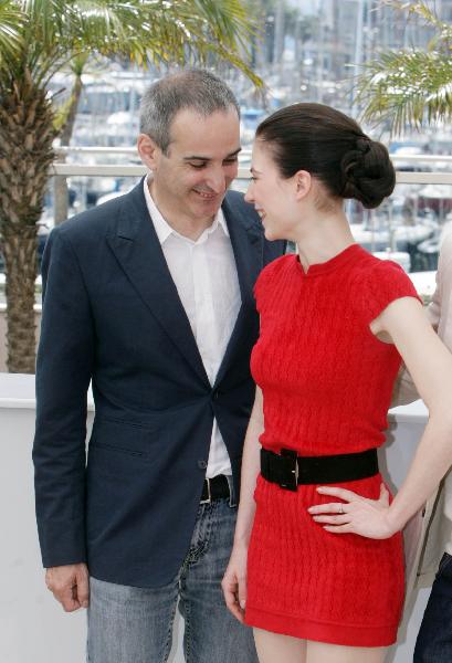 French director Olivier Assayas and Austrian actress Nora Von Waldstatten share an intimate moment during the photocall of 'Carlos' at the 63rd Cannes Film Festival on May 20, 2010. 