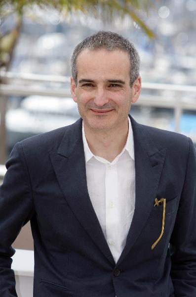 French director Olivier Assayas poses during the photocall of his film 'Carlos' at the 63rd Cannes Film Festival on May 20, 2010.