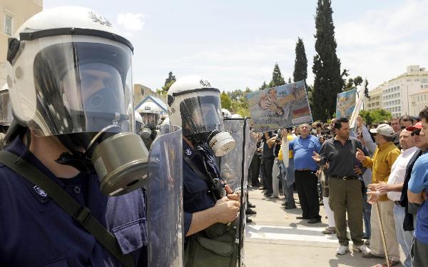 People hold a rally in Athens, capital of Greece, May 20, 2010. Greece was hit Thursday by its fourth general strike of the year against harsh austerity measures aimed at easing the cash-strapped company&apos;s financial problems. [Xinhua]