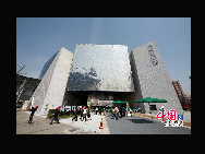 The 4,000-square-meter pavilion, named 'Magic Box,' is designed to be a metallic square with a crystal cube embedded inside. The 'Magic Box' is supported by two constructions with grid facade. A solar light system which is composed of 12 mirrors and resembles sunflowers will illuminate the underground part of the pavilion.  [Photo by Hu Di]