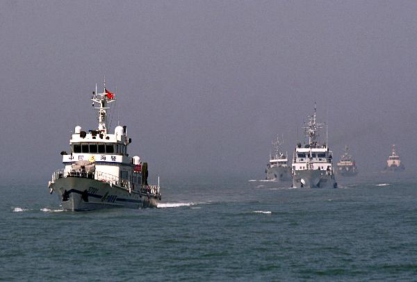 Police ships patrol in the sea area in Weihai, east China's Shandong Province, May 20, 2010.[Xinhua] 