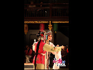 Traditional Kunqu 'Peony Pavilion' is performed at the ancient stage of Sanshan Guild Hall in Shanghai, east China. The Kunqu Opera 'Peony Pavilion' will be staged during the 2010 Shanghai World Expo for 120 times.Sanshan Guild Hall, located on 1551 Zhongshan Road South, is a municipal level historic and cultural site. According to the three-grade protective principle stipulated in Shanghai Expo master planning, Sanshan Guild Hall is a grade one building to be preserved within Expo area.[Photo by Yang Dan]
