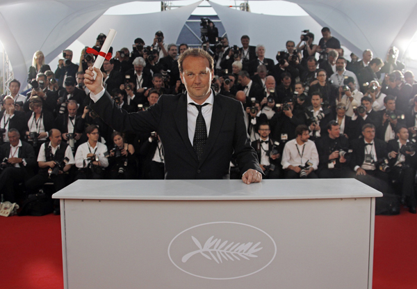 Director Xavier Beauvois poses during a photocall after winning the Grand Prix award for the film Des Hommes et des Dieux (Of Gods and Men) during the award ceremony of the 63rd Cannes Film Festival May 23, 2010.