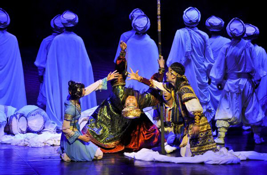Chinese artists perform in the dance drama 'The Moon Over the Helan Mountains' in Cairo Opera House in Cairo, capital of Egypt, May 23, 2010. The dance drama, which is adapted from a folktale in northwest China's Ningxia Hui Autonomous Region, tells about the hardships of a group of Arab merchants and a touching love story between a young Arab man and a Ningxia local girl on the ancient Silk Road.