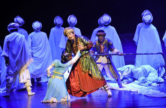 Chinese artists perform in the dance drama 'The Moon Over the Helan Mountains' in Cairo Opera House in Cairo, capital of Egypt, May 23, 2010. The dance drama, which is adapted from a folktale in northwest China's Ningxia Hui Autonomous Region, tells about the hardships of a group of Arab merchants and a touching love story between a young Arab man and a Ningxia local girl on the ancient Silk Road.