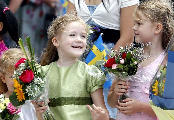 Two Swedish girls attend the celebration marking the National Pavilion Day for Sweden at the World Expo park in Shanghai, east China, May 23, 2010. 