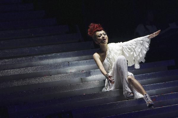 Angela Chang, a singer from southeast China's Taiwan, performs during her Singing on Pandora Vocal Concert held in Shanghai, east China, May 22, 2010.