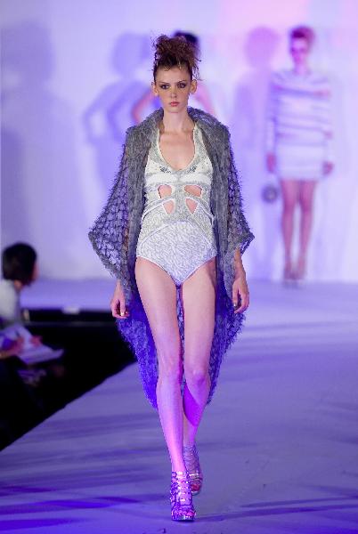 A model presents a creation by designer Chan Kua Kei during a knitwear fashion show of graduating students from the Hong Kong Polytechnic University's Institute of Textiles and Clothing in Hong Kong, south China, on May 25, 2010.