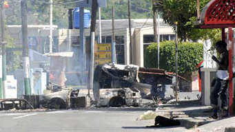 Gunbattles in Jamaican capital kill at least 30: reports