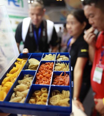 Visitors view some snack food materials during the 2010 China Beijing International Snack Food Exhibition held in Beijing, May 25, 2010. A total of 181 enterprises from 14 countries and regions took part in the exhibition that opened on Tuesday.