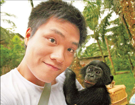 Tan Jingzhi stands with a bonobo at a sanctuary in the Democratic Republic of the Congo. 