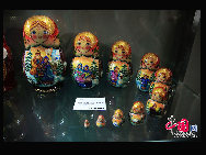 Photo taken on May 23, 2010 shows the Russian matryoshka dolls at the Russia Pavilion in the World Expo park in Shanghai, east China. Inspired by the idea of Nikolay nosov, a famous writer of children's literature, the Russia Pavilion presents an ideal city of the fairyland, where flowers, fruits and magical designs give visitors an impression of children's paradise.  [Photo by Yang Jia]