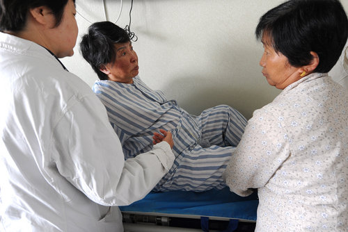 A 60-year-old pregnant woman rests at a hospital before delivery in Hefei city, capital of East China's Anhui province, on Tuesday, May 25, 2010. 