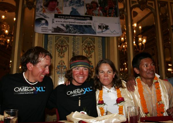 Jordan Romero (2nd, L), 13-year-old American boy who becomes the youngest climber to reach the summit of Mt. Qomolangma, poses with his father Paul Romero (L) and his step mother Karen Lundgren during a news conference in Kathmandu, capital of Nepal, May 27, 2010. Romero conquered Mt. Qomolangma on May 22, 2010. [Xinhua]