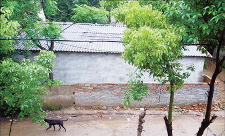 Outside Zeng Xiangbao's home in Shengying, a remote village in suburban Wuhan, capital of Hubei;