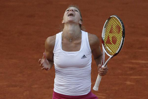 Maria Kirilenko of Russia reacts after winning her match against her compatriot Svetlana Kuznetsova during the French Open tennis tournament at Roland Garros in Paris May 28, 2010. [Xinhua/Reuters]