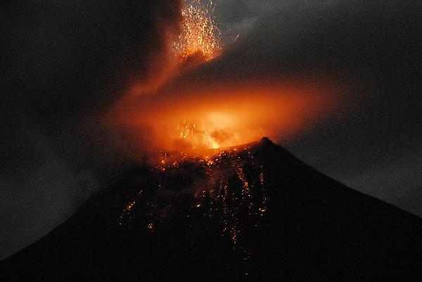 Tungurahua volcano erupts ashes and small stones during an explosion in Cotalo, some 170km south west from Ecuador's capital Quito, on May 29, 2010. Ecuadorian authorities ordered evacuation for thousands of residents near the slopes of the volcano. (Xinhua/Lourdes Robalino)