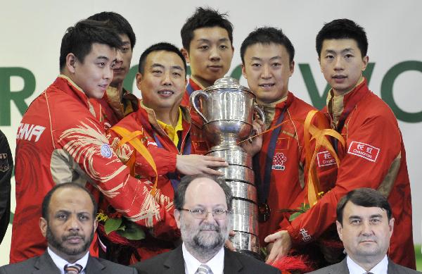 China's men's table tennis team memebers hold the trophy during the awarding ceremony at the 50th World Team Table Tennis Championships in Moscow, capital of Russia, on May 30, 2010. China defeated Germany 3-1 in the men's final match. (Xinhua/Tao Xiyi)