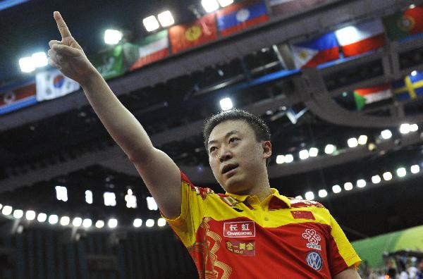 China's Ma Lin celebrates after winning the men's final match against Germany's Dimitrij Ovtcharov at the 50th World Team Table Tennis Championships in Moscow, capital of Russia, on May 30, 2010. Ma Lin won 3-0 and China defeated Germany 3-1. (Xinhua/Tao Xiyi)