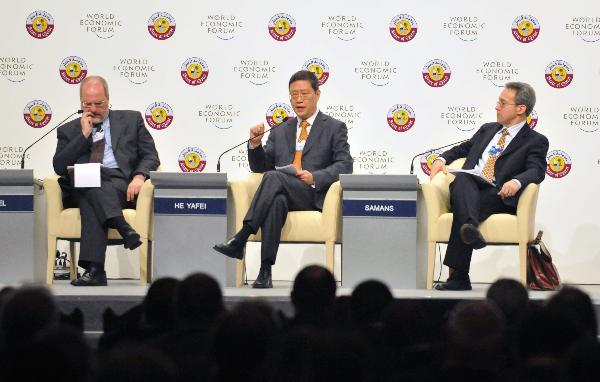 (From L to R) Alexandre Fasel, ambassador, Federal Department of Foreign Affairs of Switzerland, He Yafei, China's ambassador to the United Nations Office in Geneva, Richard Samans, managing director of the World Economic Forum, attend the plenary session 'Renovating the International System' at the World Economic Forum (WEF) Global Redesign Summit in Doha, Qatar, May 30, 2010.