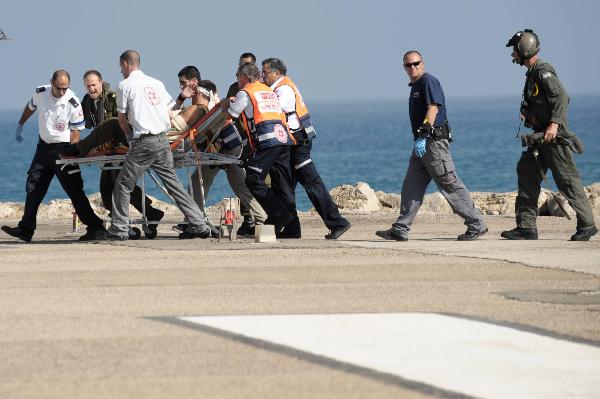 An injured person is evacuated to Rambam hospital in the northern city of Haifa, Israel, May 31, 2010. Clash happened on Monday morning between an international Gaza aid flotilla and Israeli navy, causing at least 10 casualties, Israeli military confirmed. (Xinhua)