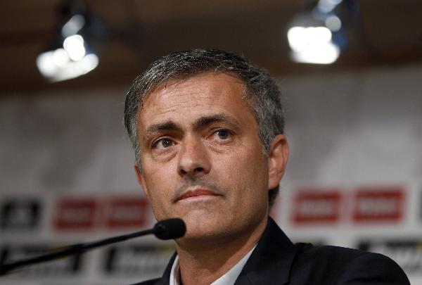 New Real Madrid coach Jose Mourinho of Portugal looks on during his official presentation at the Santiago Bernabeu stadium in Madrid, May 31, 2010. Mourinho was presented as their coach on Monday after agreeing an undisclosed compensation deal with Inter Milan, the Spanish club said on Friday. (Xinhua/Reuters Photo)