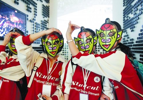 Young visitors wear monkey masks provided by the Czech Pavilion.