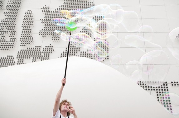 Pavilion staff perform a 'bubble show' outside the Czech Pavilion.