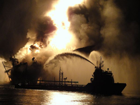 A file photo released on Tuesday by Steadfast TV shows the US Coast Guard using high-pressure water guns to extinguish the blazing Deepwater Horizon drilling platform in the Gulf of Mexico on April 22, 2010. [China Daily/Steadfast TV]