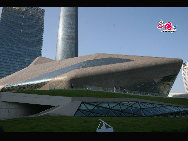 The 'Twin Boulder' is designed by London-based architect Zaha Hadid. The building takes its shape from boulders in the Zhujiang River that runs through the city of Guangzhou. The Big Boulder is the major theater of the Center, with 1800 seats, while the small boulder houses a multi-function theater with 400 seats. [Photo by Huang Yan]