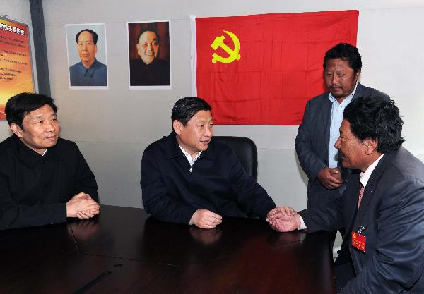 Chinese Vice President Xi Jinping (2nd L) talks with local residents in quake-hit Yushu County, northwest China's Qinghai Province, June 1, 2010. Xi arrived at Yushu to inspect the reconstruction work and visit the survivors of the quake in the quake-hit area. 