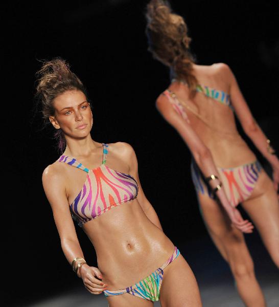 Models present designs from Triya during the final day of the 17th edition of Fashion Rio in Rio de Janeiro, Brazil, June 1, 2010. Fashion Rio ends all its show on Tuesday. 