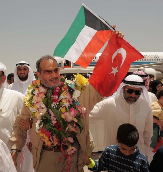 Kuwaiti Pro-Palestinian activists, who were detained aboard the Gaza-bound flotilla raided by Israel on May 31, 2010, arrive at the Kuwait international airport in Kuwait City on June 2, 2010. Israel deported all of the Gaza aid flotilla activists on Wednesday. [Xinhua] 