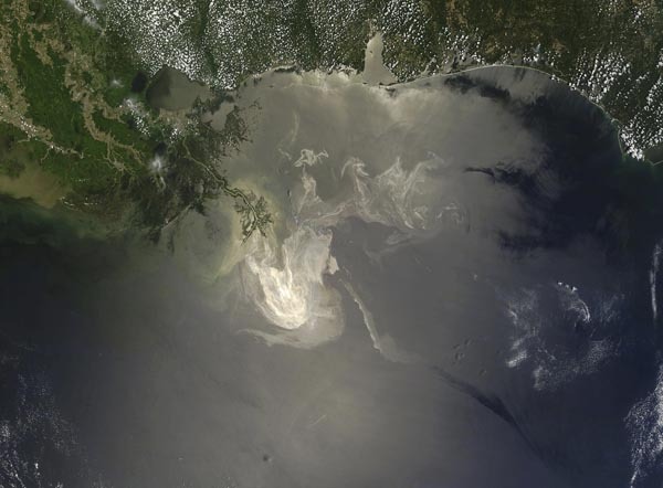 NASA MODIS satellite image, taken May 23, 2010, of the Gulf of Mexico shows the extent of the oil released from the Deepwater Horizon spill. The oil can be seen as a sheen on the water surface. [Xinhua]