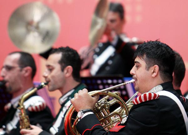 Performers of a band of Italian gendarmes play musical instruments during the ceremony marking the National Pavilion Day of Italy during the 2010 World Expo in Shanghai, east China, June 2, 2010. 