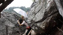 Woman dies after getting stuck in rocks