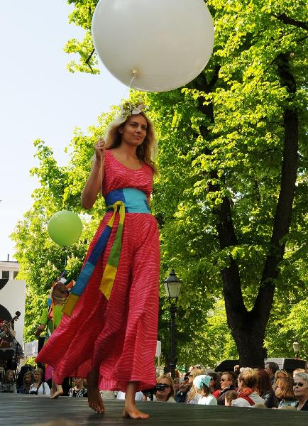 A model displays the Marimekko's summer outfit on an outdoor stage in central Helsinki, capital of Finland, June 2, 2010. 