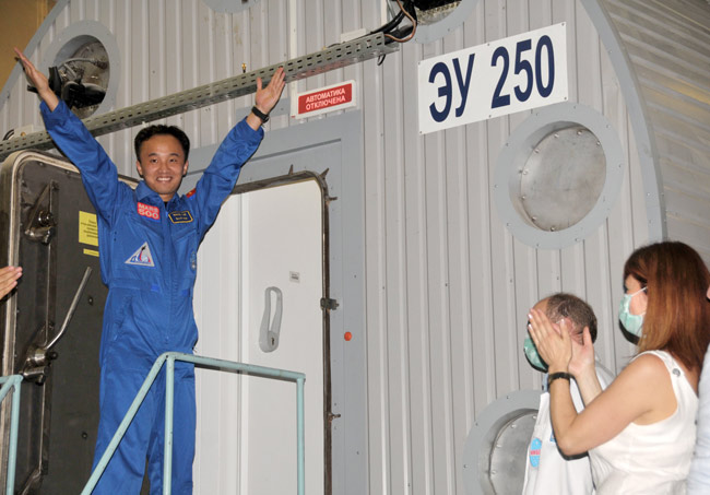 Wang Yue from China, a participant of the simulated Mars expedition, enters the Mars-500 module in Moscow, capital of Russia, June 3, 2010.