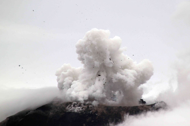 The Tungurahua volcano spews ash and rocks during an eruption in Banos, about 130 km (81 miles) southeast of Quito, June 2, 2010. Tungurahua has been classed as active since 1999 and had a strong eruption in 2008. It is one of eight active volcanoes in the country.[Xinhua]