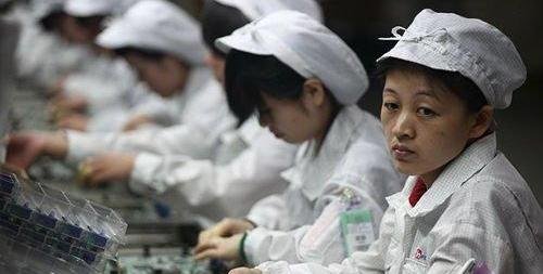 File photo: assembly line workers at Foxconn.