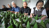 Elders show off their zongzi skills