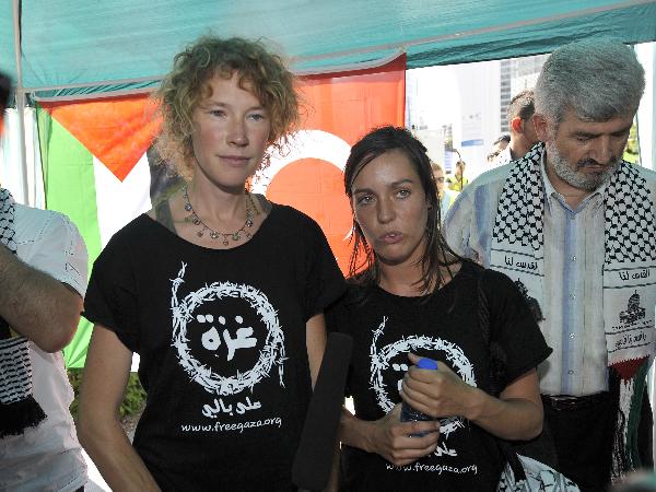 Griet De Knopper (L) and Inge Neefs who were on the aid flotilla bound for Gaza attend a demonstration rally in support of the Palestinians in Gaza and protesting against Israel&apos;s deadly attack on the aid flotilla, in Brussels, capital of Belgium, June 4, 2010. [Wu Wei/Xinhua]