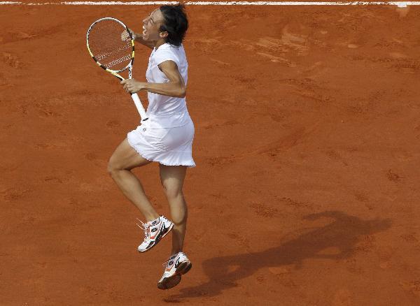 Francesca Schiavone of Italy reacts after winning the women's final against Samantha Stosur of Australia during their women's final at the French Open tennis tournament at Roland Garros in Paris June 5, 2010. [Xinhua] 