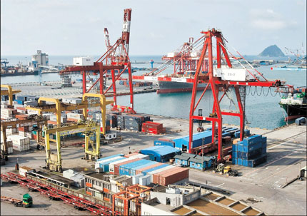 A general view shows containers stacked up at Keelung port in north Taiwan yesterday. Taiwan's exports rose 57.9 percent in May from a year earlier, well above forecasts, driven by strength in economies of the Chinese mainland and the United States, with no impact seen from problems in the eurozone.