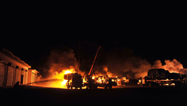 At least six persons were killed and another five injured when 10 to 12 unknown gunmen reportedly attacked 50 NATO tankers carrying oil and other essentials for supply in Afghanistan near Islamabad early morning on June 9, 2010. [Xinhua/AFP]