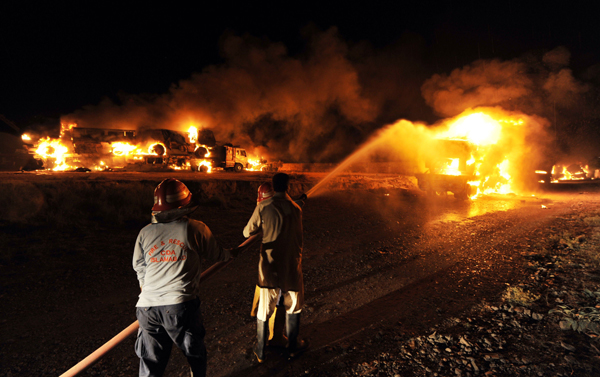 At least six persons were killed and another five injured when 10 to 12 unknown gunmen reportedly attacked 50 NATO tankers carrying oil and other essentials for supply in Afghanistan near Islamabad early morning on June 9, 2010. [Xinhua/AFP]