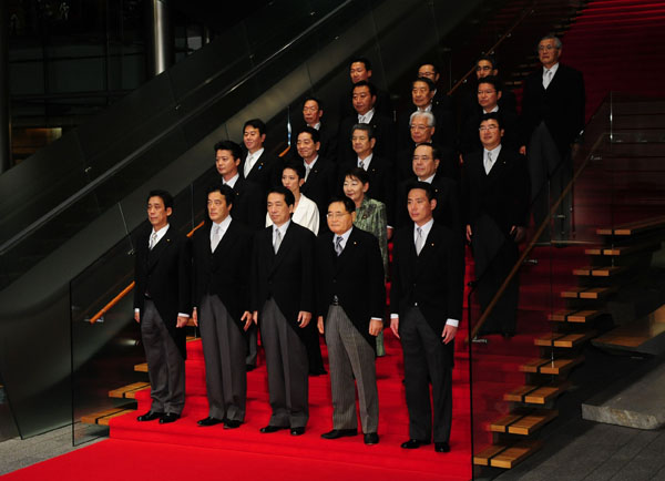 Japan&apos;s new Prime Minister Naoto Kan (front C) poses for a group photo with other cabinet members in the Prime Minister&apos;s residence in Tokyo, capital of Japan, on June 8, 2010. [Xinhua]