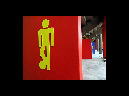 A sign with a soccer-playing figure shows the way to the men's restrooms at the Mbombela Stadium in Nelspruit, South Africa, on December 9, 2009. [China Daily/Agencies]