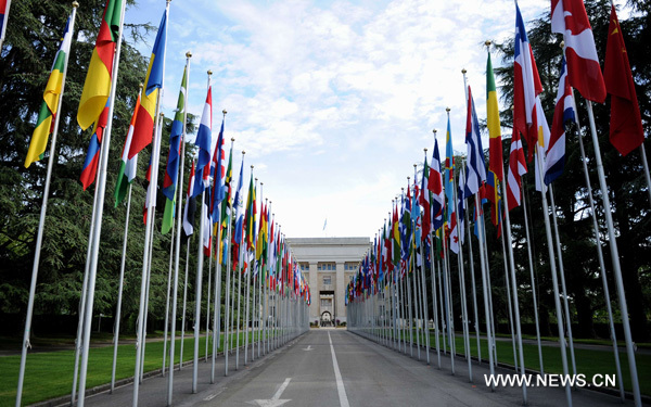 Flags are seen along the road to the Palace of Nations in Geneva, Switzerland, June 9, 2010. The Palace of Nations in Geneva was built between 1929 and 1936 as the headquarters of the League of Nations. It has served as the home of the United Nations Office in Geneva since 1946, when the UN secretary general signed the Headquarters Agreement with the Swiss authorities, although Switzerland did not become a UN member until 2002. [Xinhua/Yu Yang] 